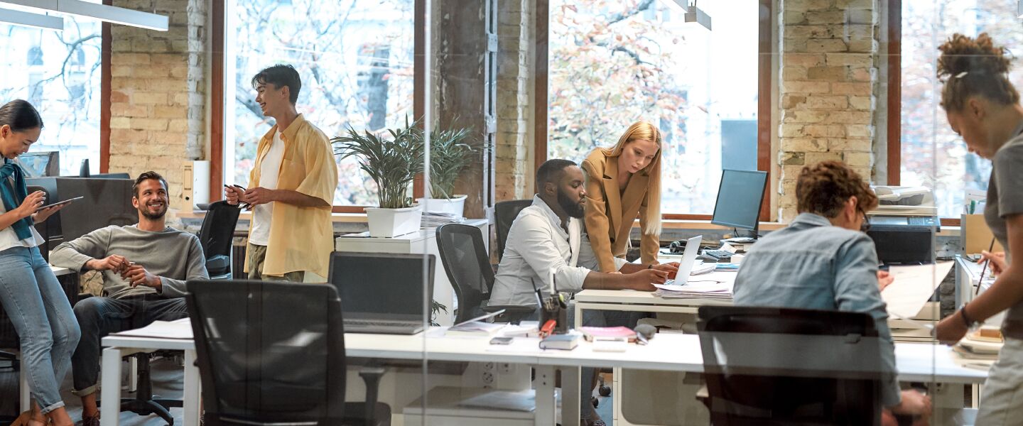 Collaborative team working on voice and video AI datasets in a modern office setting