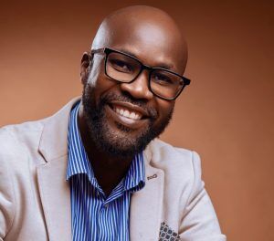 A headshot of voice actor Dan McCharles