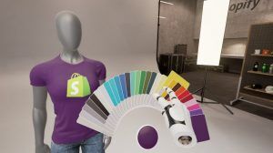 A user inside a VR program. The user is choosing a colour swatch, which is displayed on a t-shirt a mannequin is wearing.